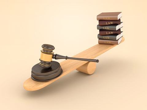 Law Books with Gavel on Seesaw - Color Background - 3D Rendering