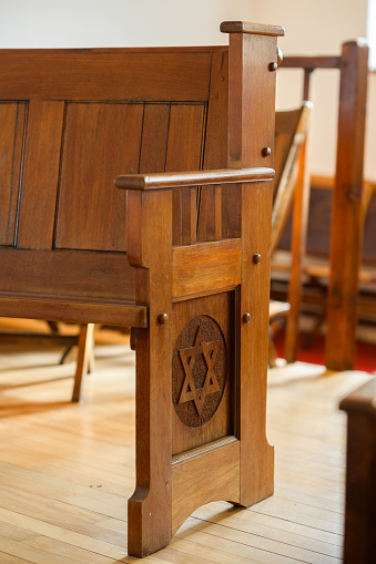 Star of David Jewish symbol on Shul Synagogue wooden pew.