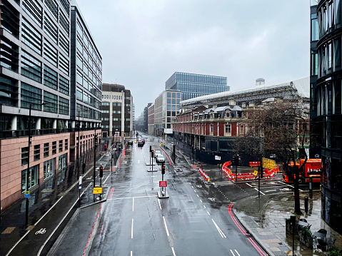 Looking down on Farringdon Road from Holborn Viaduct on a rainy day. April 2023