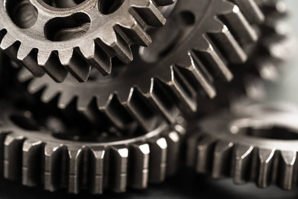 istock Gear and cogs wheels, clock mechanism, brass metal engine industrial. 1782033823