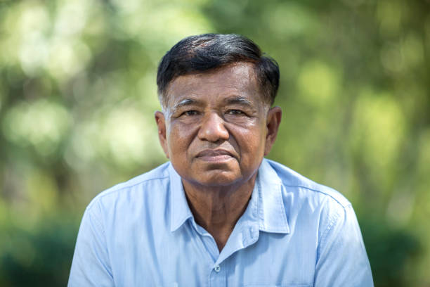 istock Close-up of smiling elderly man's face outdoors in nature. 1782038691