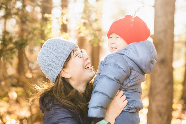istock Mother Holds Son and Lifts High with Delight 1782053287