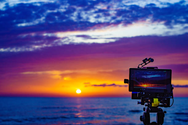 istock Camera taking photos of sunrise over sea 1782071598
