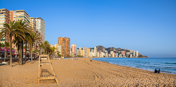 Skyscrapers lined up on the seafront of Benidorm, a very popular tourist destination on the Costa Blanca (2 shots stitched)