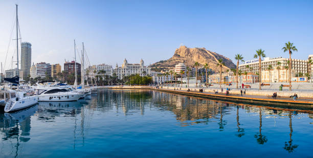 Yachts moored at the marina of Alicante, from where you can see the Castillo de Santa Barbara - Santa Barbara Castle, a fortification located on the Mount Benacantil (8 shots stitched)