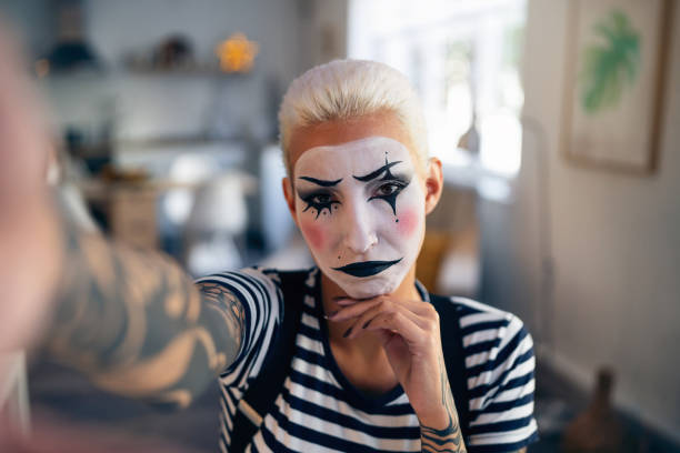istock Young woman, a mime artist, taking selfies at home while getting ready for pantomime show. 1782080222