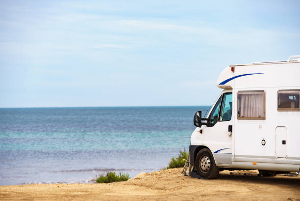 istock Camper on beach seashore. Holidays trip. 1782080274