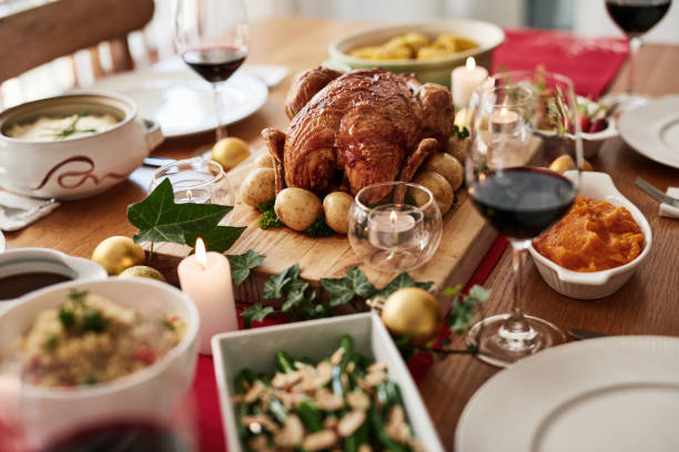 istock Thanksgiving roast, celebration and a chicken on a table in the dining room from above for tradition. Food, meat and turkey with a gourmet meal or feast in a home for a social event of holiday in usa 1782081497