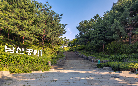 The Entrance stairway to Namsan Park, Seoul, South Korea with signage in Korea name. A beautiful public natural landmark near N-Seoul Tower, You can see a beautiful view of Seoul city at this observation point.