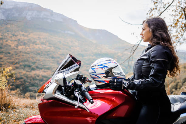 istock Female motorcycle rider enjoys nature 1782092140
