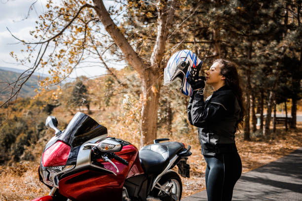 Young woman prepares for moto ride