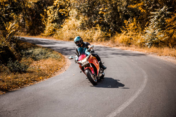 istock Biker enjoys ride on country road 1782092760