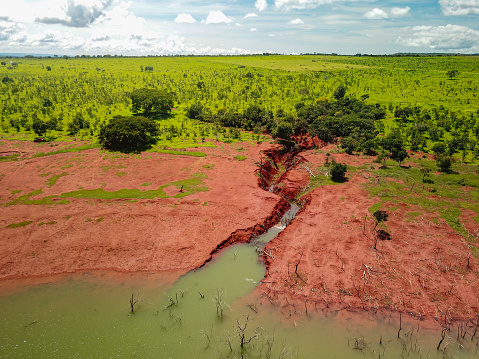 Erosion that evolved into a gully on the banks of the São Marcos River, which forms the border between the states of Minas Gerais and Goiás in Brazil.