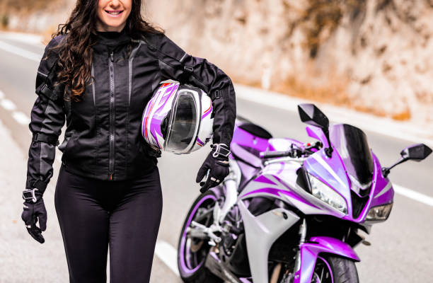 istock Female biker and her motorcycle 1782095049