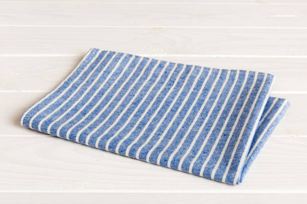 istock top view with blue kitchen napkin isolated on table background. Folded cloth for mockup with copy space, Flat lay. Minimal style 1782101758