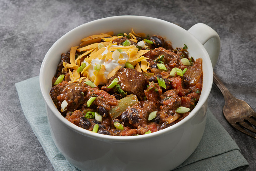 Steak Chili with Black Beans, Onions, Sour Cream, Scallions and Cheddar Cheese