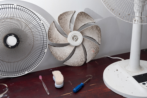 cleaning dirty electric fan