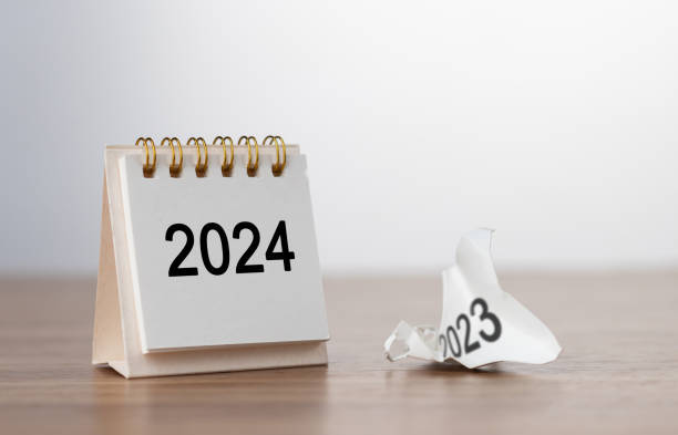 istock 2024 Happy New year background. Turns over a calendar sheet. Setup objective target business cost and budget planning of new year concept. year change from 2023 to 2024. 1782123380