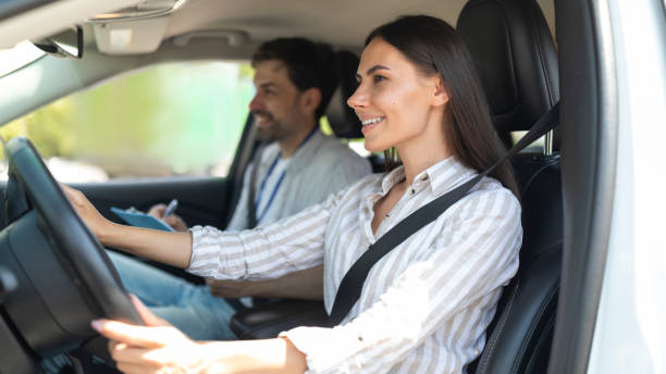 istock Cheerful confident young woman passing exams at driving school 1782123949