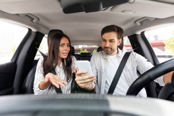 istock Angry young woman shouting while car driver using phone 1782124480