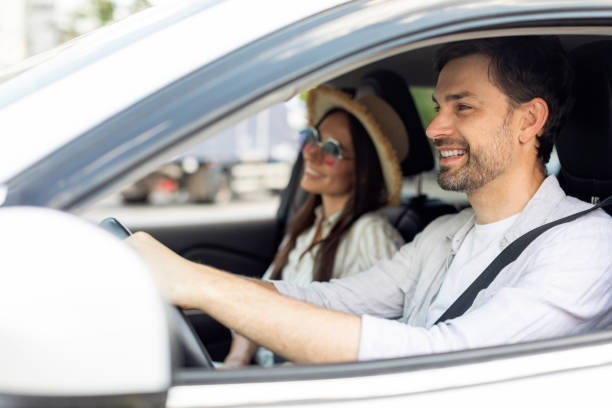 istock Smiling positive couple going summer vacation by car 1782125136