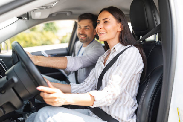 istock Smiling young brunette woman practicing parking at driving school 1782125251