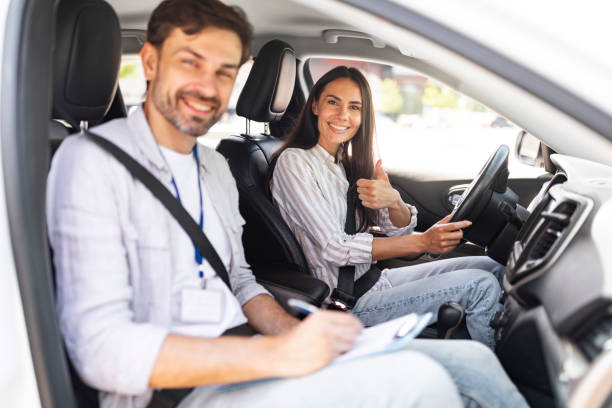 istock Man instructor examinating brunette lady student in driving school 1782125253