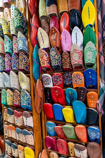 A variety of colorful shoes on display at the market in Marrakesh, Morocco.