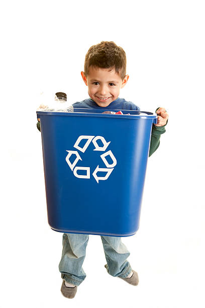 istock Go Green: Hispanic Little Boy Holding Full Recycling Bin 178216115