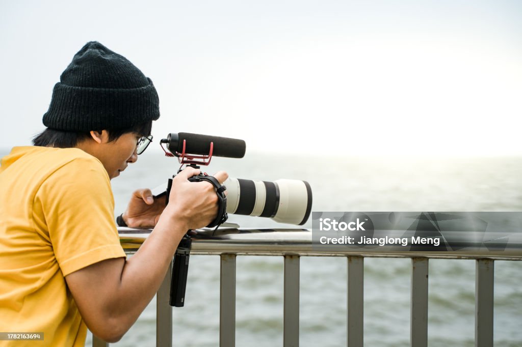 Person Image Using Camera Young People Are Using The Camera To Shoot Stock Photo - Download Image ...