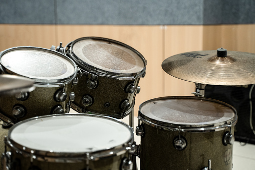 A nice red /brown wood hand drum isolated on a white background.