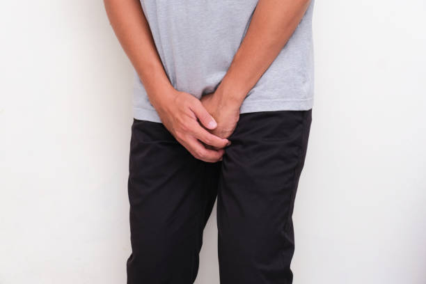 A man holding his crotch suffering prostate cancer