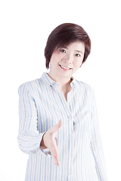 asian business woman wants to shake-hands with you isolated on white background