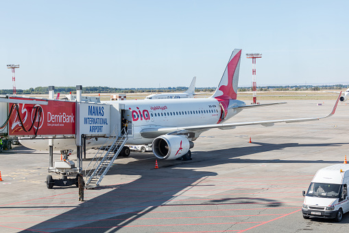 Bishkek, Kyrgyzstan - September 26, 2023: A6-ANR Air Arabia Airbus A320-214(WL) with jetway at the Manas International Airport