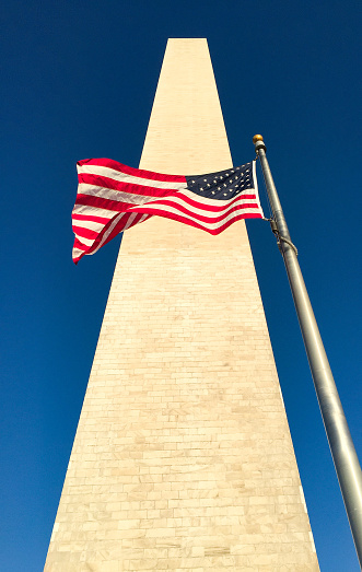 Washington Monument and American Flag in Washington, DC.