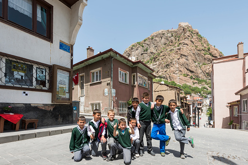 Primary school students posing on Afyonkarahisar Mevlevi Konağı Street. May 18, 2015