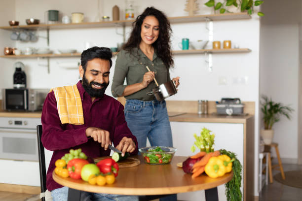 istock Happy middle eastern couple cooking together, making delicious meal, man preparing vegetable salad, kitchen interior 1782208414