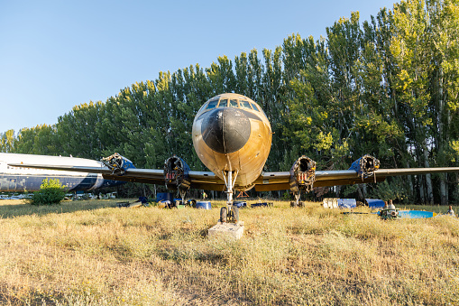 Airplane crash scene on the ground.