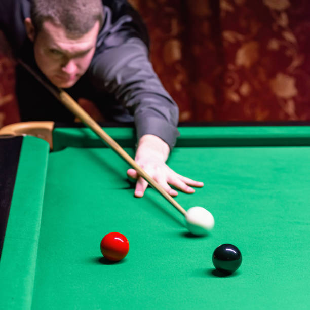 istock A snooker player initiates the game with focus and determination. 1782215449