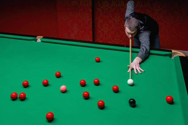 istock A skilled snooker player engaged in a captivating game of precision and strategy. 1782216095