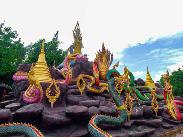 istock The Naga statue's imposing presence against the expansive blue sky creates a visually captivating scene, fostering a feeling of reverence and fascination for its mythical significance. 1782221919