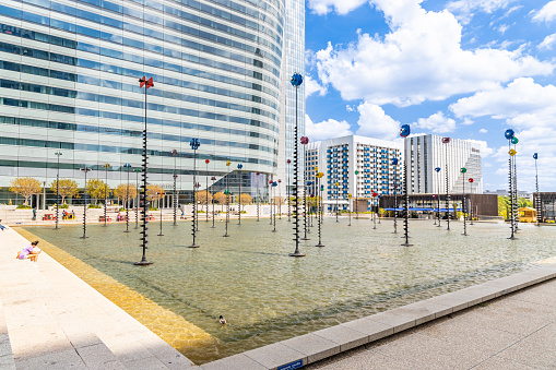 Le Bassin, a Takis installation, with a basin and metal rods, it is one of the works of art of la Defense (1988) in Paris, France