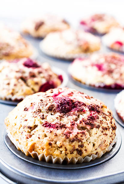 istock Berry muffins with chocolate sprinkles in baking tray. Closeup. 178223500