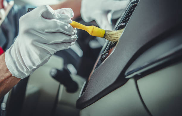 istock Vehicle Detailing Worker Cleaning Car Vents Using Soft Brush 1782255978