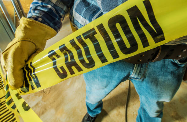 istock Installing Yellow Caution Tape in Dangerous Place 1782255993