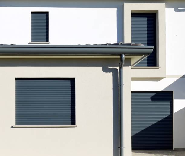 istock Dark gray modern rolling shutters of a new built house. 1782316081
