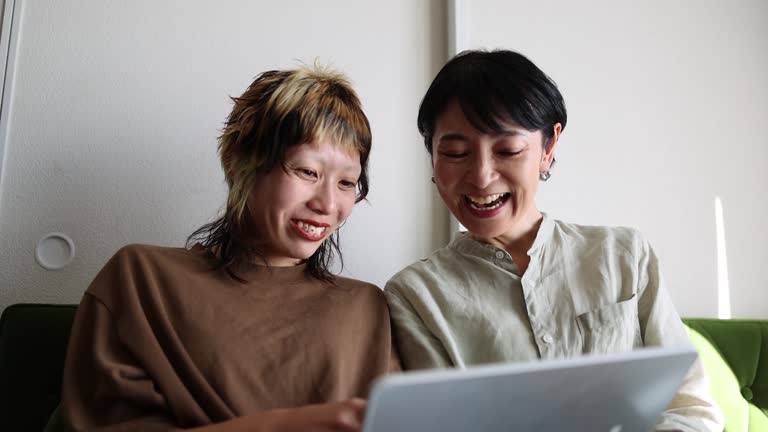 Asian Family Enjoy Movie By Tablet