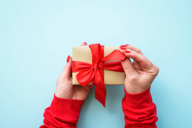 istock Boxing day. Woman giving christmas present. 1782329295