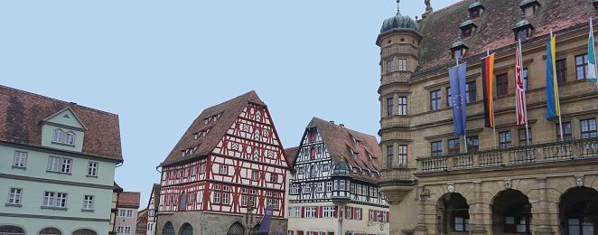 The facades of historical buildings at Rothenburg ob der Tauber where is the fortified city in Germany.