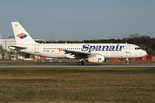 Frankfurt am Main, Germany - April 2, 2011: Spanair Airbus A320-200 with registration EC-IMB on take off roll on runway 18 (called Startbahn West) of Frankfurt Airport.